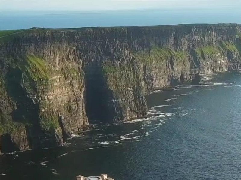 The sheer face of the Cliffs of Moher, its shale and sandstone stacked in horizontal bands