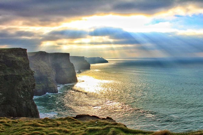 Light breaking through cloud over the Cliffs of Moher