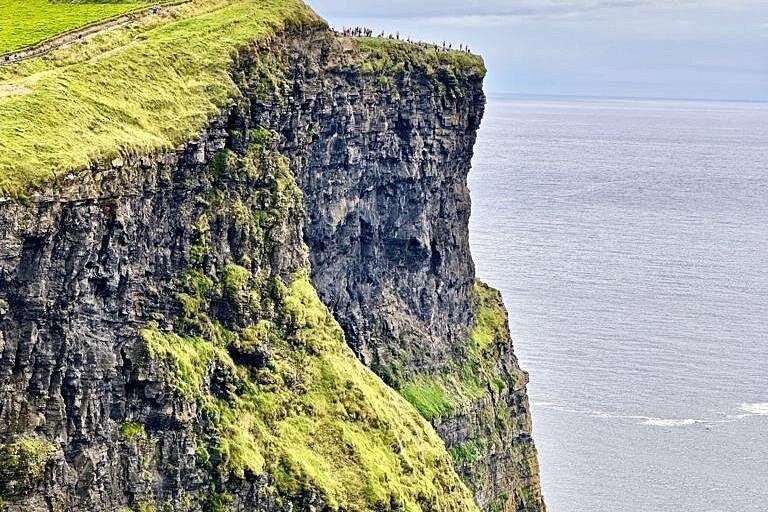 The near-vertical drop of the Cliffs of Moher, taken from the cliff top