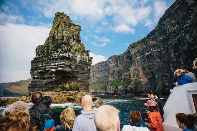Looking up at the Cliffs of Moher from the deck of the Doolin cruise